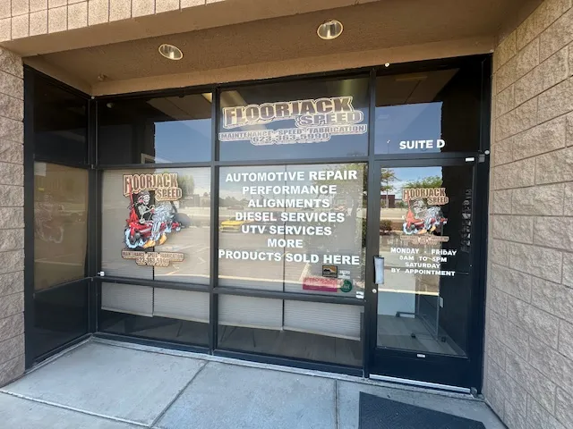 The Floorjack Auto Repair storefront on N. Black Canyon Hwy in Phoenix, the sign listing automotive repair, performance, alignments, diesel and UTV services