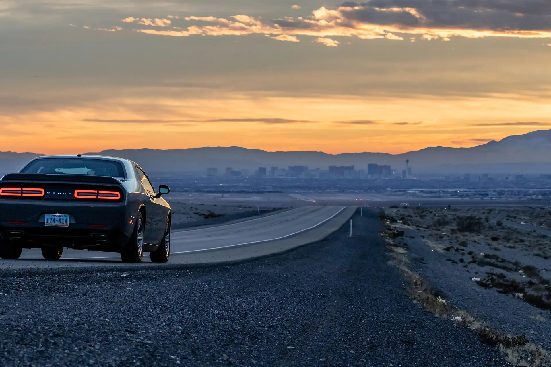 Dodge Challenger on desert road near Phoenix, Arizona, auto repair services.
